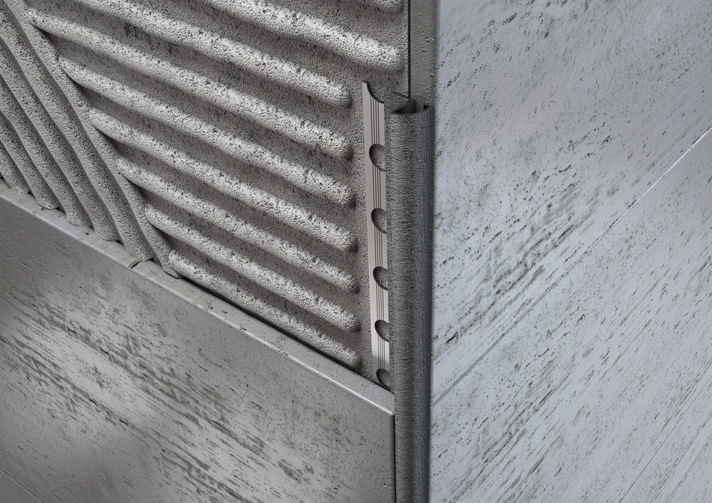
                  
                    Profilo Decorato in Alluminio Wenge Angolo Tondo per Piastrelle
                  
                
